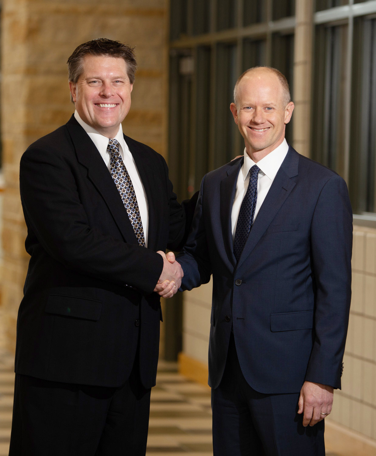 two men shaking hands